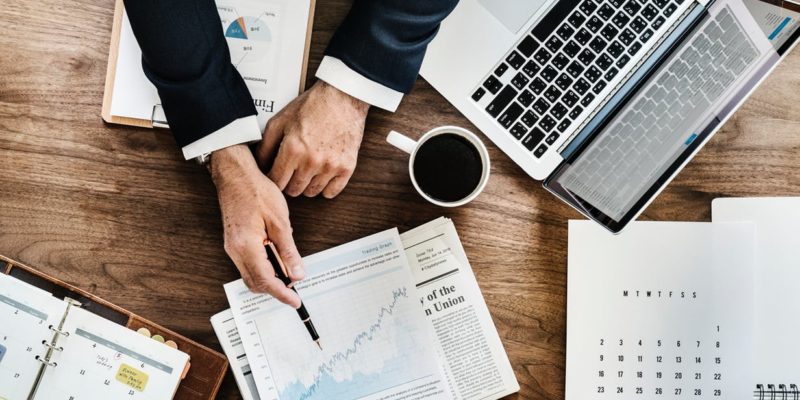 Photo of Person Holding Black Pen