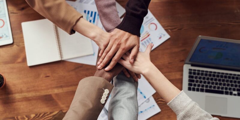 Free Photo Of People Near Wooden Table Stock Photo